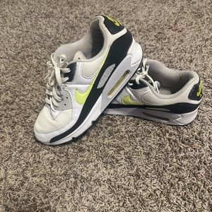 Black, white green and gray Nike air maxes in a size 10
